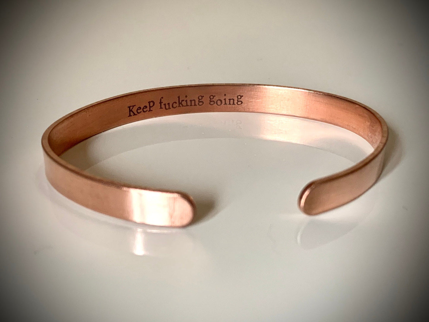 Keep f*cking going - Thin copper bangle with hidden motivational message