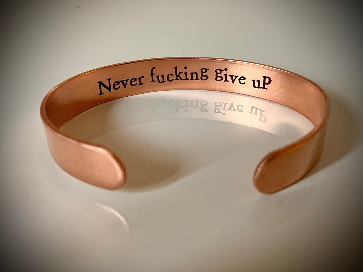 Never f*cking give up - Wide copper cuff bracelet with hidden motivational message